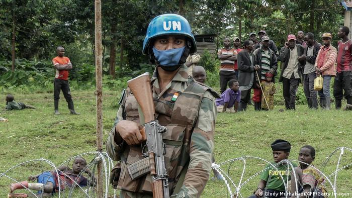 A UN peacekeeper patrols a new base