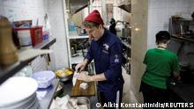 Ukrainian celebrity chef Ievgen Klopotenko cooks in his restaurant’s kitchen, in Lviv, Ukraine, March 29, 2022. Klopotenko, who came from Kyiv to Lviv when Russia’s attack on Ukraine started, opened a restaurant where he offers free meals for refugees. REUTERS/Alkis Konstantinidis