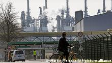 A worker rides his bicycle to the BP oil refinery Ruhr Oil in Gelsenkirchen, Germany, Monday, March 28, 2022. An embargo on Russian oil would mean great loss of jobs in Germany. Before the war in Ukraine, Europe's most pressing energy policy goal was reducing carbon emissions that cause climate change. Now, officials are fixated on rapidly reducing the continent's reliance on Russian oil and natural gas. (AP Photo/Martin Meissner)