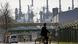 A worker rides his bicycle to the BP oil refinery Ruhr Oil in Gelsenkirchen, Germany, Monday, March 28, 2022. A worker rides his bicycle to the BP oil refinery Ruhr Oil in Gelsenkirchen, Germany, Monday, March 28, 2022.