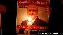 FILE PHOTO: A demonstrator holds a poster with a picture of Saudi journalist Jamal Khashoggi outside the Saudi Arabia consulate in Istanbul, Turkey October 25, 2018. REUTERS/Osman Orsal/File Photo