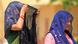 Two women cover their heads on a hot day Two women cover their heads on a hot day
