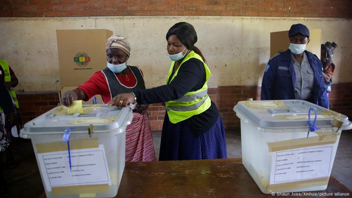 A woman casts her ballot at a polling station in Harare