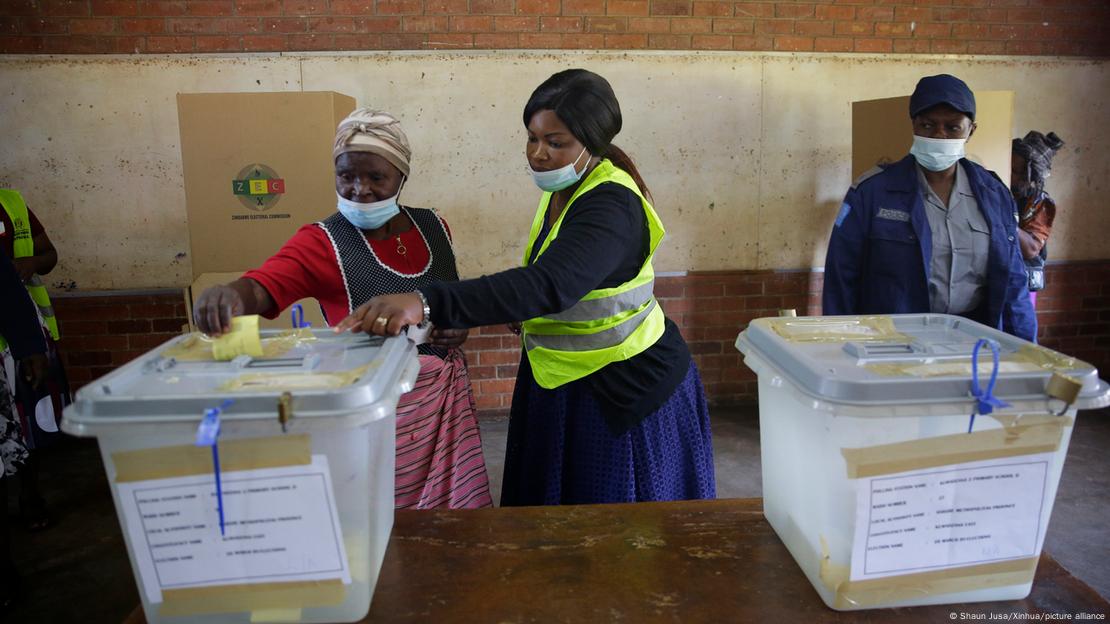 A woman casts her ballot at a polling station in Harare, Zimbabwe