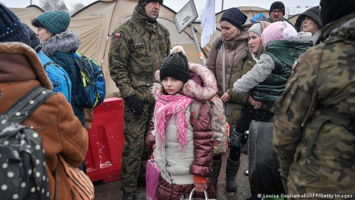 A girl arrives at a Polish refugee camp