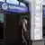 A man walks out of a Gazprombank office