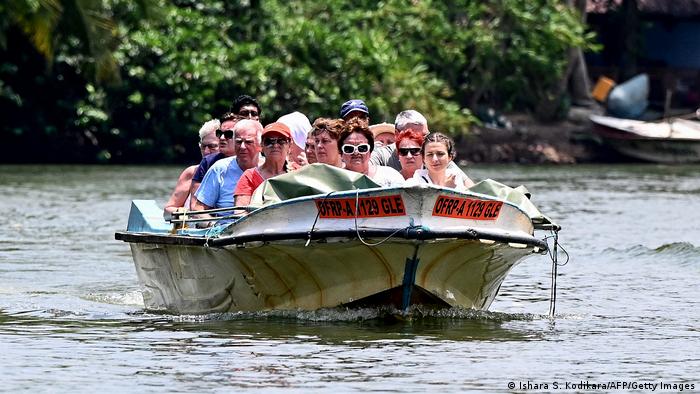 Tourists in a boat in Sri Lanka