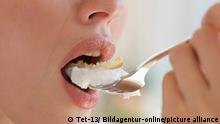 Close up of woman eating cake