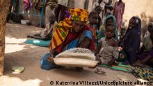 epa05666671 A handout picture provided by the United Nations Children's Fund (UNICEF) on 08 December 2016 shows woman sorting rice at a so-called 'widows' house' in Banki, Borno State, northeast Nigeria, 15 November 2016. According to UNICEF, many women in Banki who have become separated from their husbands during the Boko Haram-related crisis, now live in groups along with their children in the town's semi-destroyed houses, known as 'widows' homes', as they wait to find out if their husbands are still alive. Banki was captured by Boko Haram in September 2014 and retaken by the Nigerian military in September 2015. EPA/KATERRINA VITTOZZI / UNICEF / HANDOUT HANDOUT EDITORIAL USE ONLY/NO SALES ++
