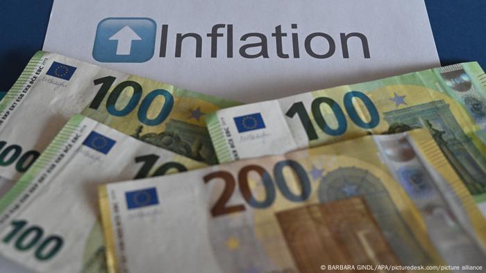 Euro notes with the word inflation printed in the background