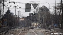 A view shows a road and buildings damaged in the course of Ukraine-Russia conflict in the southern port city of Mariupol, Ukraine April 1, 2022. REUTERS/Stringer