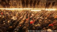 Muslim worshippers perform a night prayer called 'tarawih' during the eve of the first day of the Muslim holy fasting month of Ramadan in Turkey at Hagia Sophia mosque in Istanbul, Turkey, Friday, April 1, 2022. (AP Photo/Emrah Gurel)