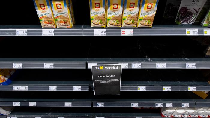 Almost empty shelves of flour in a German supermarket