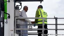 Pope Francis arrives to board a plane for his visit to Malta, at Leonardo da Vinci-Fiumicino Airport in Rome, Italy, April 2, 2022. REUTERS/Yara Nardi
