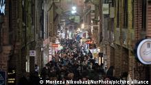 Iranian people walk along a corridor while shopping in Tehranâs Traditional Grand bazaar amid the COVID-19 outbreak in Iran on January 27, 2021. (Photo by Morteza Nikoubazl/NurPhoto)