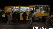 Passengers disembark as a convoy of 30 buses carrying evacuees from Mariupol and Melitopol arrive at the registration center in Zaporizhzhia, on April 1, 2022. - Late on April 1, people who managed to flee Mariupol to Russian-occupied Berdiansk were from there carried on dozens of buses to Zaporizhzhia, some 200 kilometers (120 miles) to the northwest, according to an AFP reporter on the scene. (Photo by emre caylak / AFP) (Photo by EMRE CAYLAK/AFP via Getty Images)