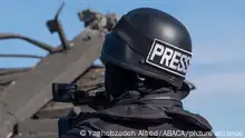 Person wearing a helmet saying Press from behind