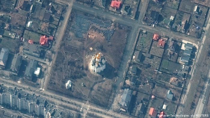 A satellite image shows a grave site near the Church of St Andrew and Pyervozvannoho All Saints, in Bucha