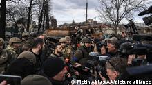 BUCHA, KYIV PROVINCE, UKRAINE, APRIL 04: Ukrainian President Volodymyr Zelenskyy accompanied by Ukrainian soldiers speaks to press during his visit at the town of Bucha, after it was liberated from Russian Army, in Bucha, Ukraine on April 04, 2022. Metin Aktas / Anadolu Agency