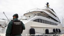 A Civil Guard stands by the yacht called Tango in Palma de Mallorca, Spain, Monday April 4, 2022. U.S. federal agents and Spain's Civil Guard are searching the yacht owned by a Russian oligarch. The yacht is among the assets linked to Viktor Vekselberg, a billionaire and close ally with Russia's President Vladimir Putin, who heads the Moscow-based Renova Group, a conglomerate encompassing metals, mining, tech and other assets, according to U.S. Treasury Department documents. All of Vekselberg's assets in the U.S. are frozen and U.S. companies are forbidden from doing business with him and his entities. (AP Photo/Francisco Ubilla)