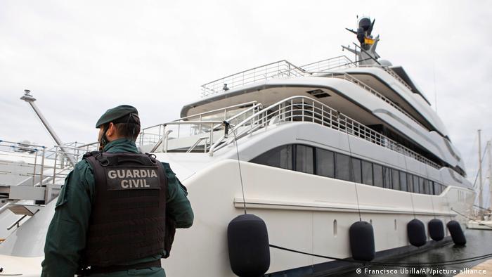 A Spanish Civil Guard stands by the yacht owned by a Russian oligarch Viktor Vekselberg which was seized at a Mallorca shipyard