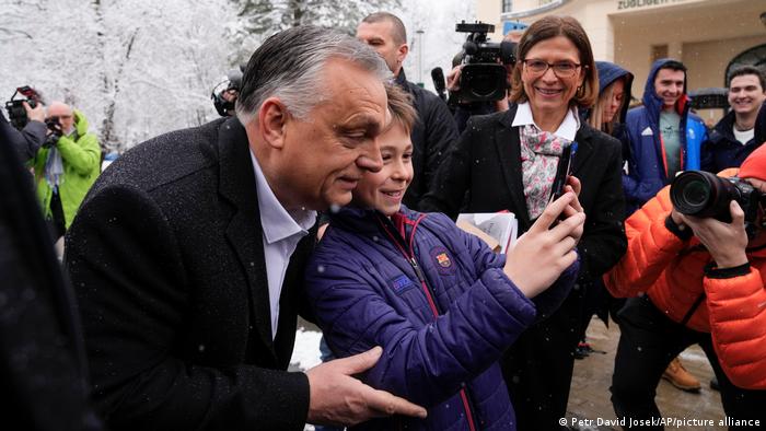 Viktor Orban poses with child on ahead of elections