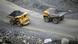 A loaded dump truck passes an empty truck as it carries away coal at the Kedrovsky open-pit coal mine in Kemerovo, Russia, Tuesday, June 16, 2015. A loaded dump truck passes an empty truck as it carries away coal at the Kedrovsky open-pit coal mine in Kemerovo, Russia, Tuesday, June 16, 2015.