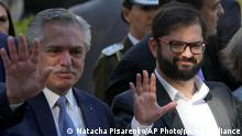 Chile's President Gabriel Boric, right, and Argentine President Alberto Fernandez arrive for a visit to the Space for Memory and for the Promotion and Defense of Human Rights Museum in Buenos Aires, Argentina, Tuesday, April 5, 2022. The museum was formerly the Argentine Navy School of Mechanics where torture took place during the country's 1976-1983 military dictatorship. (AP Photo/Natacha Pisarenko)