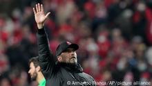 Liverpool's manager Jurgen Klopp waves towards Liverpool supporters at the end the Champions League quarterfinals, first leg, soccer match between Benfica and Liverpool at the Luz stadium in Lisbon, Tuesday, April 5, 2022. (AP Photo/Armando Franca)