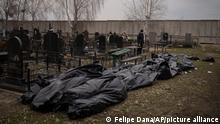 Dozens of bodies wait to be buried at a cemetery in Bucha, outskirts of Kyiv, Ukraine, Tuesday, April 5, 2022. Ukraine’s president told the U.N. Security Council on Tuesday that the Russian military must be brought to justice immediately for war crimes, accusing invading troops of the worst atrocities since World War II. He stressed that Bucha was only one place and there are more with similar horrors. (AP Photo/Felipe Dana)