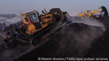 KEMEROVO REGION, RUSSIA - DECEMBER 27, 2021: Coal extraction at the Zarechny open-pit coal mine of Siberian Coal Energy Company (SUEK) in the village of Zarechny. Siberian Coal Energy Company is Russia's largest coal supplier and one of the leading coal and energy companies of the world. The company produces over 30 mln tonnes of steam coal a year. The highest is 38.2 mln tonnes. SUEK-Kuzbass, a subsidiary of Siberian Coal Energy Company, ranks first in volume of underground mining in Russia. Maxim Kiselev/TASS