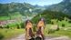 Hiking boots in the foreground with a view of mountains and a valley in the Allgäu Alps. Hiking boots in the foreground with a view of mountains and a valley in the Allgäu Alps.