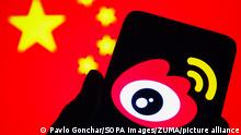 December 9, 2021, Ukraine: In this photo illustration, a Weibo (Sina Weibo) logo of a Chinese social media platform is seen on a smartphone with a flag of China in the background. (Credit Image: © Pavlo Gonchar/SOPA Images via ZUMA Press Wire