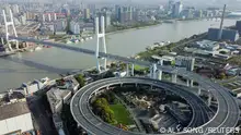An aerial view shows a bridge over the Huangpu river, amid traffic restrictions and a lockdown in the Pudong area to contain the spread of the coronavirus disease (COVID-19) in Shanghai, China, March 29, 2022. Picture taken with a drone. REUTERS/Aly Song