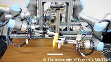 A dual-armed robot picks up a banana and peels it without squashing the fruit inside during a demonstration in this handout image taken December 2, 2021 and released by ISI (Kuniyoshi) Lab., School of Info. Sci & Tech., The University of Tokyo, Japan. Picture taken December 2, 2021. ISI (Kuniyoshi) Lab., School of Info. Sci & Tech., The University of Tokyo/Handout via REUTERS ATTENTION EDITORS - THIS IMAGE HAS BEEN SUPPLIED BY A THIRD PARTY. MANDATORY CREDIT. NO RESALES. NO ARCHIVES.
