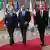 Left to right: Armenia Prime Minister Nikol Pashinyan, European Commission chief Charles Michel and Azerbaijan President Ilham Aliyev walk down a hall at the Brussels summit