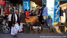 Yemenis shop at a market during the Muslim holy fasting month of Ramadan, in the capital Sanaa on April 6, 2022. - A two-month truce has started in war-torn Yemen, in a rare sign of hope for a country battered by seven years of conflict. The Iran-backed Huthi rebels and Saudi-led coalition have both agreed to observe the truce, which took effect at 1600 GMT on April 2, the first day of Ramadan, the Muslim holy fasting month. (Photo by MOHAMMED HUWAIS / AFP)