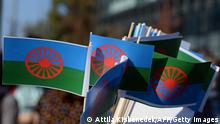 Roma flags are seen prior to a march of the Roma Pride Day to protest against racism and discrimination that the Roma community faces in Europe in Budapest, on October 19, 2014. AFP PHOTO / ATTILA KISBENEDEK (Photo credit should read ATTILA KISBENEDEK/AFP via Getty Images)