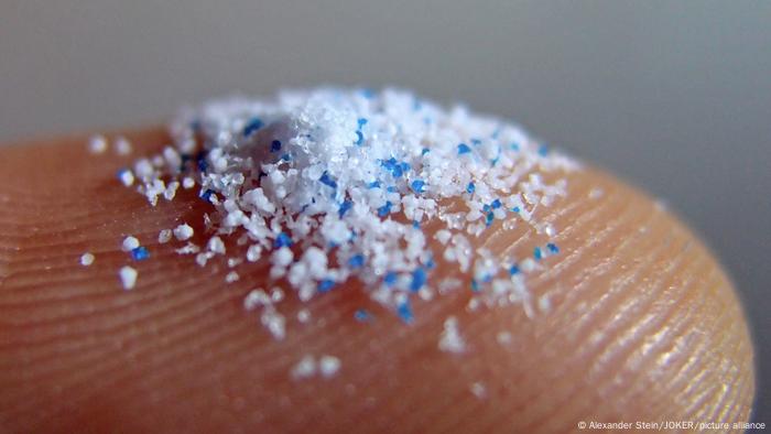Microplastic on a finger 