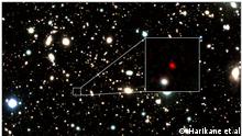 HD1, object in red, appears at the center of a zoom-in image. An international team of astronomers, including researchers at the Center for Astrophysics | Harvard & Smithsonian, has spotted the most distant astronomical object ever: a galaxy.
Named HD1, the galaxy candidate is some 13.5 billion light-years away and is described today in The Astrophysical Journal. In an accompanying paper published in the Monthly Notices of the Royal Astronomical Society Letters, scientists have begun to speculate exactly what the galaxy is.