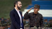 Salvadoran President Nayib Bukele (L) and Defence Minister Rene Merino Monroy participate in the graduation of new military personnel, at the Captain General Gerardo Barrios Military School, in Antiguo Cuscatlan, El Salvador, on April 4, 2022. (Photo by Marvin RECINOS / AFP) (Photo by MARVIN RECINOS/AFP via Getty Images)
