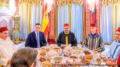 A picture of Moroccan King Mohammed VI, Spain's Prime Minister Pedro Sanchez, Crown Prince Moulay Hassan, Prince Moulay Rachid, the king's brother, and Morocco's Prime Minister Aziz Akhannouch, posing before an Iftar meal at the royal palace