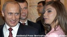(FILE) A file picture dated 04 November 2004 of Russian President Vladimir Putin (L) and Russian gymnast Alina Kabayeva in the Kremlin, Moscow, Russia. A Russian tabloid broke taboo by reporting on 11 April 2008 that Russia's president Vladimir Putin had divorced his wife Lyudimilla and plans to wed 24-year-old former Olympic gymnast Alina Kabayeva. EPA/PRESIDENTIAL PRESS SERVICE/ITAR-TASS POOL +++ dpa-Bildfunk +++