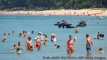 International tourists, predominantly Russian nationals, enjoy the beach despite concerns over the spread of the COVID-19 coronavirus and restrictions for travellers at a resort in Phuket on March 20, 2020. (Photo by Mladen ANTONOV / AFP) (Photo by MLADEN ANTONOV/AFP via Getty Images)