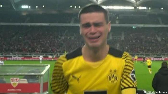Close-up of Borussia Dortmund’s Giovanni Reyna leaves the field in tears after sustaining a hamstring injury inside two minutes of Dortmund’s game against Stuttgart at the Mercedes-Benz Arena in Stuttgart on April 8, 2022