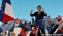 French President and La Republique en Marche (LREM) party candidate for re-election Emmanuel Macron gestures as he addresses sympathizers after the first results of the first round of France's presidential election at the Paris Expo Porte de Versailles Hall 6 in Paris, on April 10, 2022. - French President Emmanuel Macron leads far-right leader Marine Le Pen in the first round of France's elections on April 10, 2022 by a larger than expected margin, with the rivals now set to battle for the presidency in a run-off later this month, projections showed. (Photo by Ludovic MARIN / AFP)