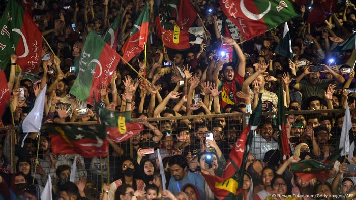 Supporters of Pakistan Tehreek-e-Insaf (PTI) party of dismissed Pakistan's prime minister Imran Khan,wave party flags as take part in a rally in his support in Karachi on April 10, 2022.