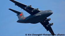 FILE - A Y-20 transport aircraft of the Chinese People's Liberation Army (PLA) Air Force performs during the 12th China International Aviation and Aerospace Exhibition, also known as Airshow China 2018, in Zhuhai city, southern China on Nov. 7, 2018. Media and military experts said Sunday, April 10, 2022, that six Chinese Air Force Y-20 transport planes landed at Belgrade's commercial airport early Saturday, reportedly carrying HQ-22 surface-to-air missile systems for the Serbian military.(AP Photo/Kin Cheung, File)