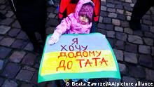 KRAKOW, POLAND - APRIL 10 : A child attends 'Mothers' March' as part of Stand with Ukraine international protest, in Krakow, Poland on April 10, 2022. Ukrainian mothers and supporters gathered to demonstrate solidarity with all victims of Russian attacks on Ukraine. Beata Zawrzel / Anadolu Agency