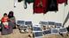 A woman and her child sit near a collection of small solar panels in a refugee camp in Erbil, Iraq A woman and her child sit near a collection of small solar panels in a refugee camp in Erbil, Iraq